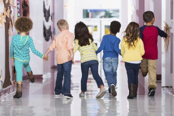 rear-view-group-preschoolers-walking-hallway